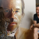 Alum Anne Middleton working on a portrait of Guy Pearce as he sits next to her