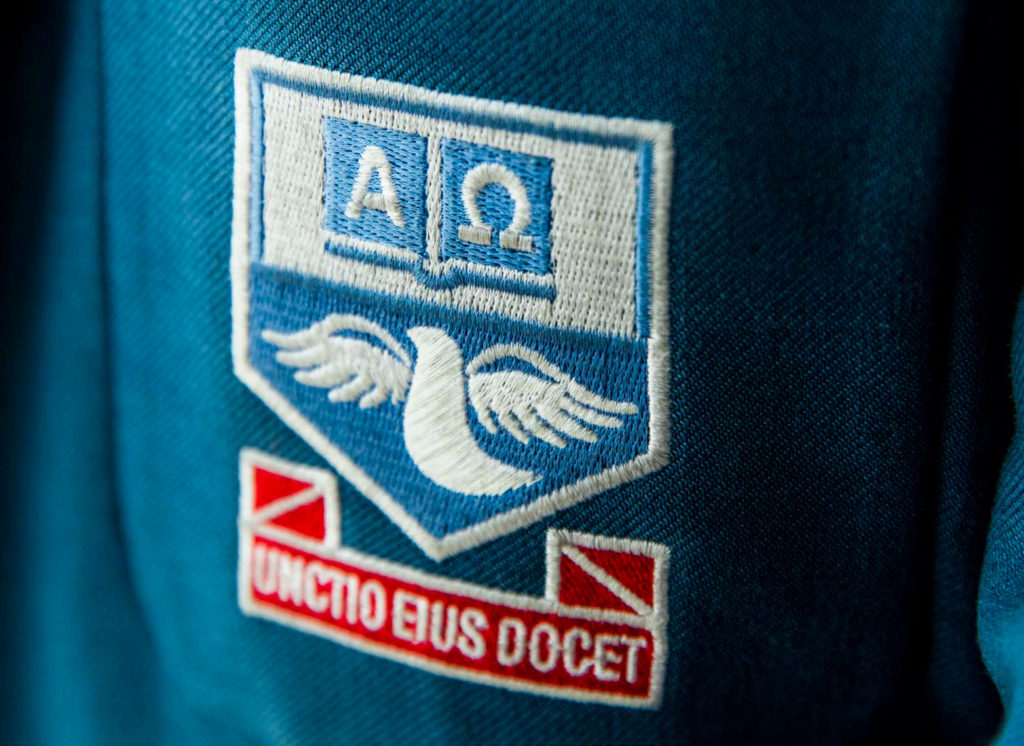A closeup of an embroidered blazer pocket